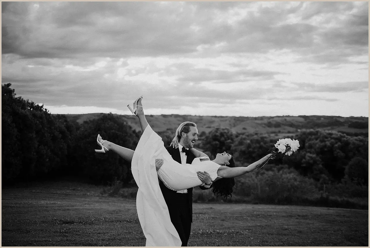 Jess & Rich at The Orchard Estate: The bride turns with her veil and bouquet in the breeze.