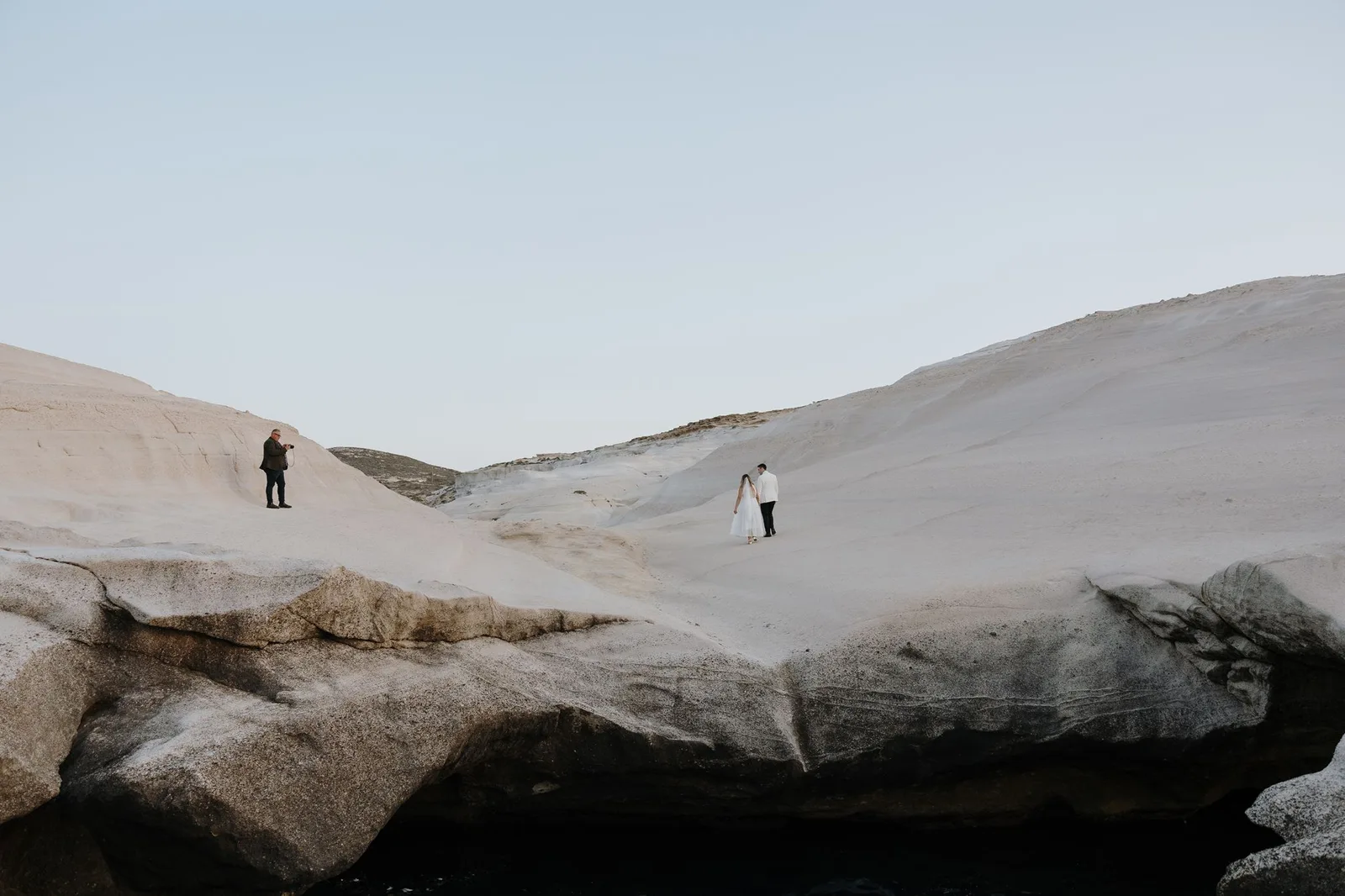 It's me photographing a couple I'd just married in Milos, Greece.