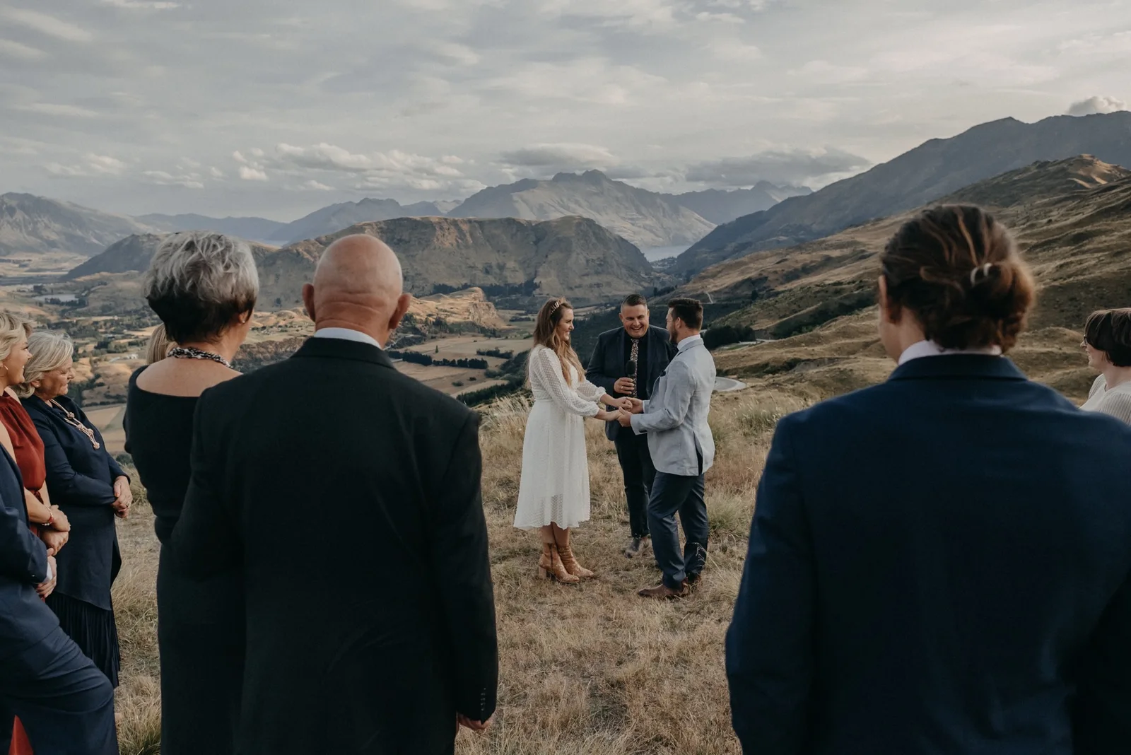 On top of Coronet Peak in New Zealand's Queenstown Montana and Craig are getting married with their celebrant, Josh Withers.