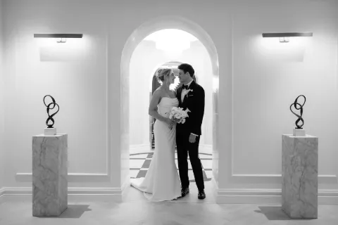 Bride beside groom in a Germanicos bespoke wedding suit